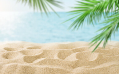Summer sea and seascape with palm branches, clean beige sand and yacht in foreground with empty space for text. Defocus blurred travel and vacation backdrop. Abstract summer background design element © kasia2003