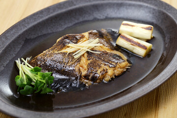 Boiled flatfish in a broth of sweetened soy sauce-based dashi, Japanese cuisine
