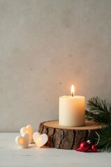 A Serene Winter Solstice Illuminated Heart Candles and a Glowing Pillar Candle Resting on a Rustic Wooden Slice, Adorned with Festive Ornaments and Evergreen Sprigs