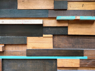 Colorful rustic wood plank in vintage paint color, in natural wood, brown, black, and cyan paint. Weathered vintage wooden plank decoration. Old antique wood, good for wall design.