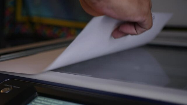 Close up office man using scanner panel the Office professional multi-function printer scanner for scanning document and printing. a Copy machines