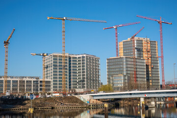 Office building construction site with cranes seen in Berlin, Germany