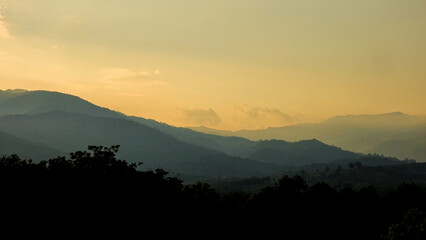 Sunset Over Mountain Layers with Dramatic Sky