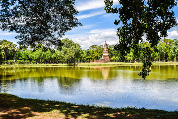 Ancient Pagoda Reflected in Lake at Sukhothai Historical Park, Thailand

