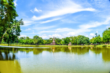 Ancient Pagoda Reflected in Lake at Sukhothai Historical Park, Thailand

