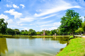 Ancient Pagoda Reflected in Lake at Sukhothai Historical Park, Thailand

