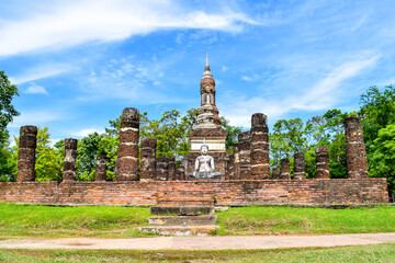Ancient Buddha statue and ruins of old temple in Sukhothai Historical Park, Thailand