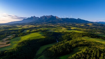 Panoramic vista of lush valleys and a majestic mountain range.