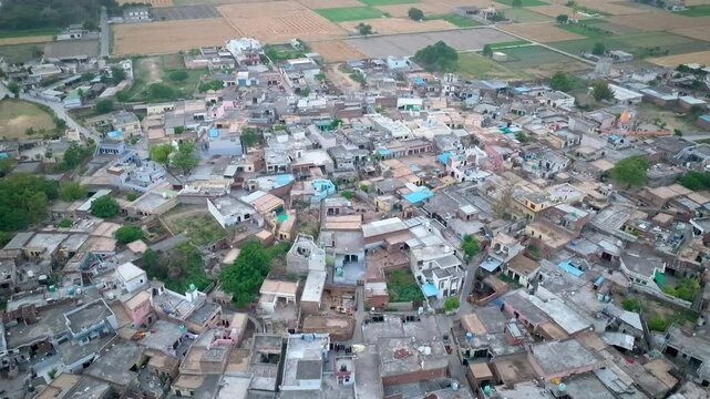 Drone Footage of Overpopulated Indian(Punjab) Village with Packed Houses and Crop Fields

