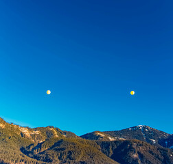 Alpine winter view with hot air balloons at Gosau, Abtenau, Salzkammergut, Salzburg, Austria