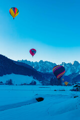 Alpine winter view with hot air balloons at Gosau, Abtenau, Salzkammergut, Salzburg, Austria