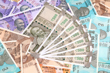 Close-up image of Indian rupee notes (INR) of different values. Concept of cash savings, financial profit and security, Indian economy.