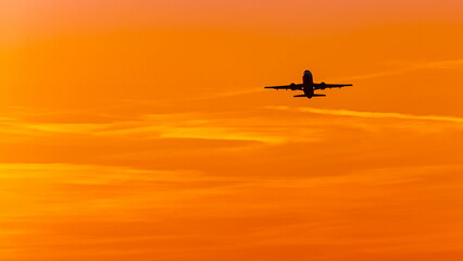 Summer sunset or sundowner view with a jet airplane at Munich airport, MUC, Freising, Bavaria, Germany
