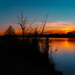 Summer sunset or sundowner view with reflections near Plattling, Isar, Deggendorf, Bavaria, Germany