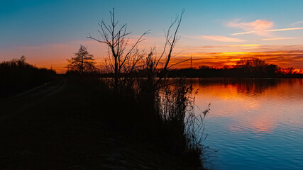 Summer sunset or sundowner view with reflections near Plattling, Isar, Deggendorf, Bavaria, Germany