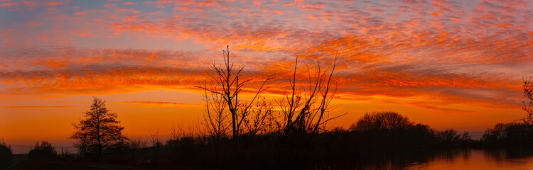 Sunset with reflections near Plattling, Isar, Bavaria, Germany
