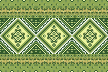 vibrant geometric pattern features layered diamond motifs in various shades of green and cream, accented with triangular borders and intricate square details. design draws inspiration from traditional