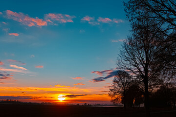 Sunset with a church silhouette near Wallersdorf, Dingolfing-Landau, Bavaria, Germany