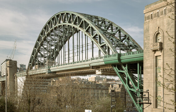 View of Tyne Bridge featured at a dynamic angle showing the parabolic arch of the bridge spanning spanning the River Tyne in Newcastle Upon Tyne in the North East of England. use it as your Wallpaper.