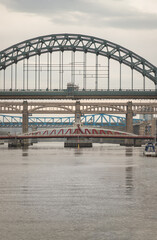 Stunning view of the Newcastle upon tyne with Tyne bridge, Swing bridge and The High level bridge spanning the River Tyne connecting Newcastle upon tyne and Gateshead in North East England. sunset.