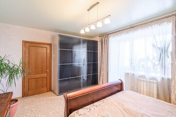 interior room apartment bedroom with bed, cozy place to sleep and relax