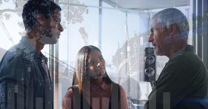 Image of financial data processing and cityscape over diverse business people - Powered by Adobe