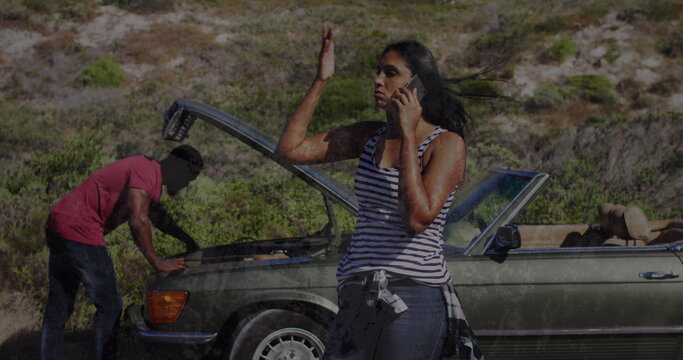 Image of stressed diverse couple calling for assistance