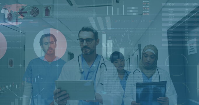 Image of graphs and data over diverse female and male doctors with x ray walking in hospital - Powered by Adobe