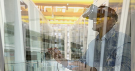 Image of men using vr headset over server room