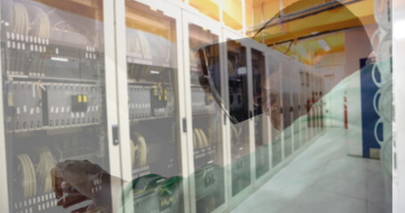 Image of men using vr headset over server room