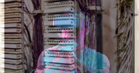 Image of men using vr headset over server room