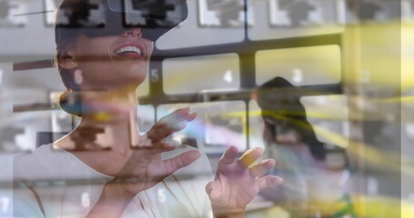Image of women using vr headset over server room