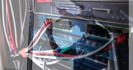 Image of men using vr headset over server room