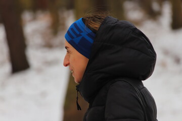 Woman in warm winter clothing enjoying the cold outdoors