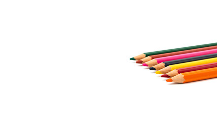 Fototapeta premium Multiple colored pencils aligned, recently sharpened on bright white background