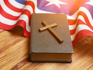 Holy Bible, Christian cross and US flag. Indoor. God Bless America.