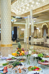 The decor for the celebration. Flower decoration. Close-up of candles