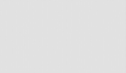 Soft white corduroy fabric displaying textured vertical lines, providing elegant design backdrop