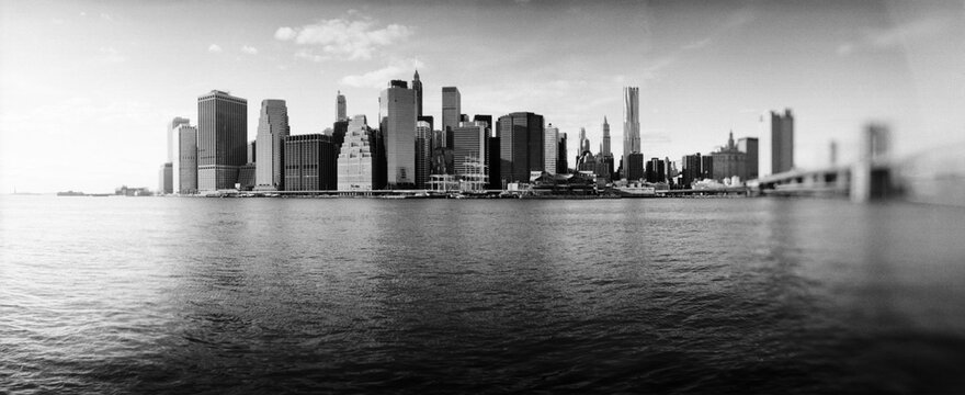 Fototapeta Black and white image of Buildings at the waterfront, Brooklyn Bridge Park, Brooklyn, Manhattan, New York City, New York State, USA.