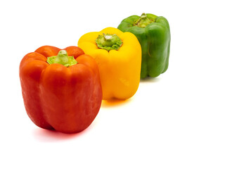 three colored bell peppers isolated on white background