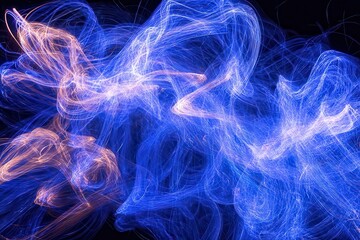 Obraz premium Vibrant Flowing Light Trails in Blue and Orange Hues Against Black