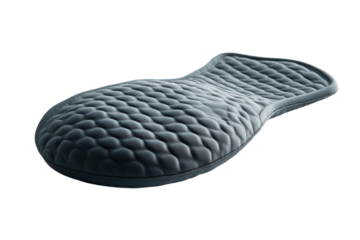 A luxuriously textured grey pad showcasing its unique quilted design against a stark black background The soft plush material is on transparent background