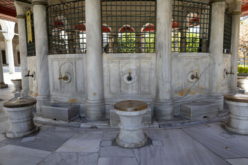 Close-Up View of Traditional Ottoman Ablution Fountain with Marble Basin and Stool