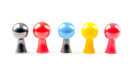 Obraz premium Colorful set of push pins on a white background, front view.