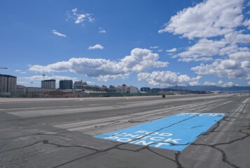 Gibraltar, United Kingdom - Mar 26, 2025: Walking in Gibraltar. Airport landing strip. Streets, buildings. Lifestyle in the urban area. Sunny spring day. Selective focus