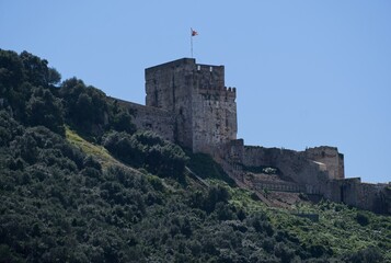 Gibraltar, United Kingdom - Mar 26, 2025: Walking in Gibraltar. Moorish Castle. Streets, buildings. Lifestyle in the urban area. Sunny spring day. Selective focus
