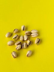 Pistachio nut on a yellow background