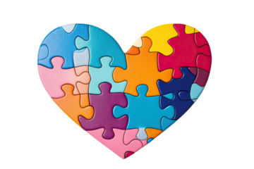 Colorful puzzle pieces forming a heart shape on a white isolated background.