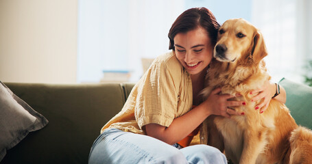 Woman, golden retriever and hug in home on sofa, smile and bonding in morning for love in living...