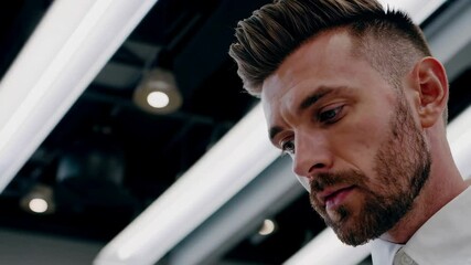 Crafting a refined look in an upscale grooming salon with expert styling techniques and modern ambiance